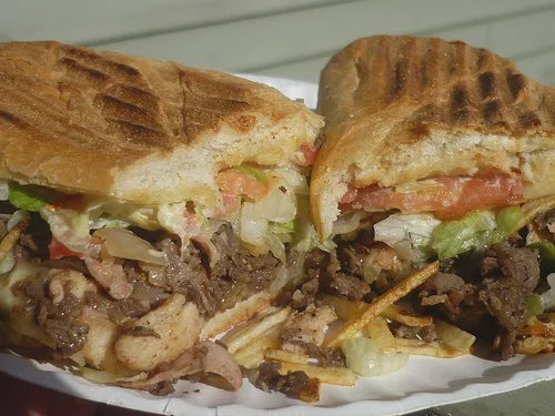 Pressed tripleta sandwich stuffed with three meats